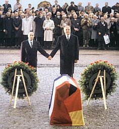 Mitterand and Kohl holding hands at Verdun.